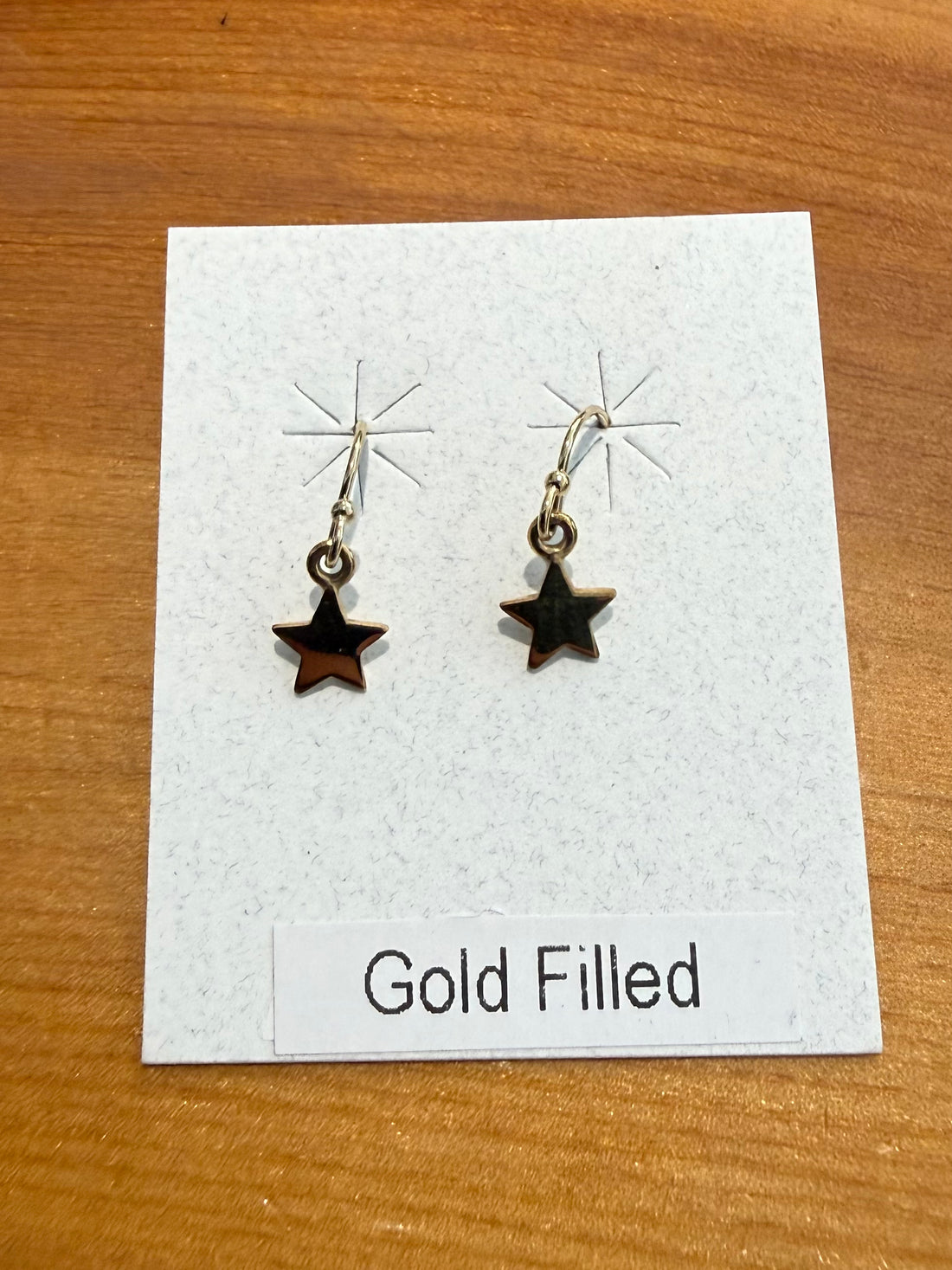 Gold Star Dangle Earrings